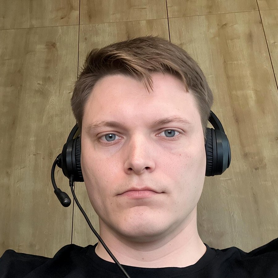 Portrait of Alexander Valenchits wearing a headset indoors